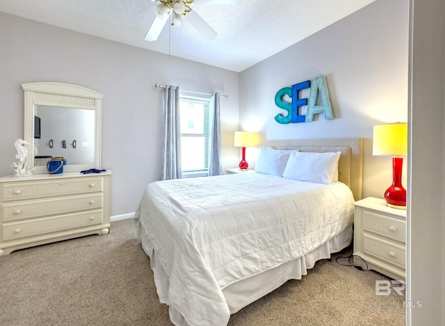 bedroom with light carpet, a textured ceiling, and ceiling fan