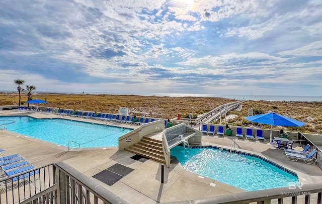 view of pool featuring a patio area