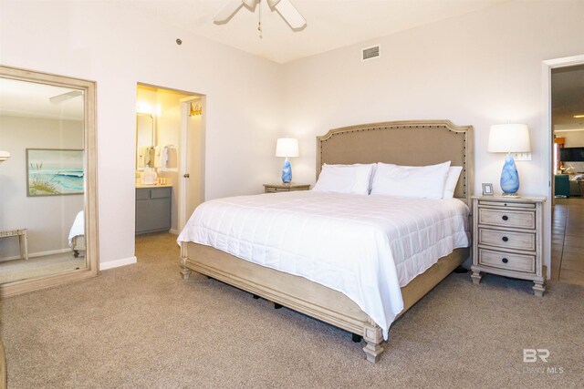 carpeted bedroom featuring ensuite bathroom and ceiling fan