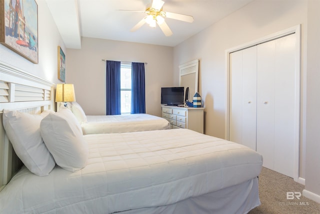 bedroom featuring carpet, a closet, and ceiling fan