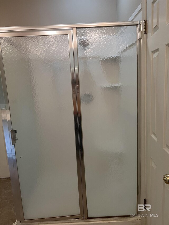 bathroom with a shower stall