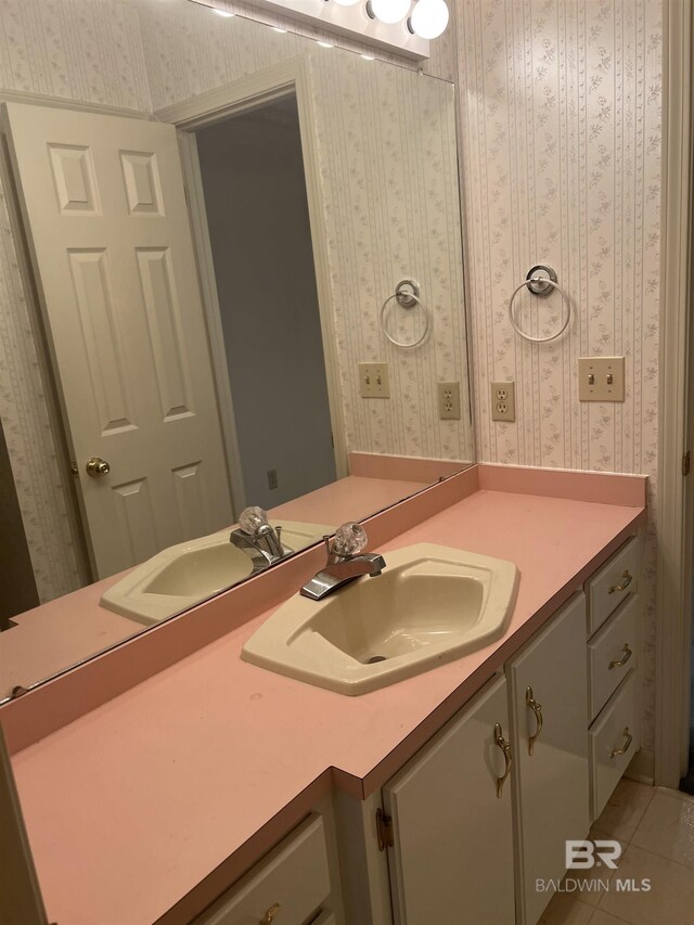 bathroom featuring wallpapered walls, vanity, and tile patterned flooring