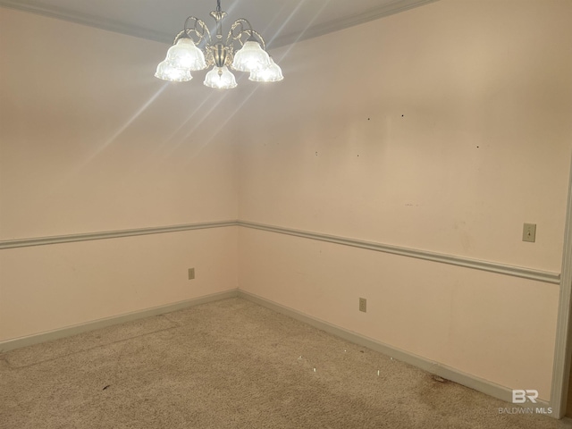 unfurnished room with carpet, a chandelier, and baseboards