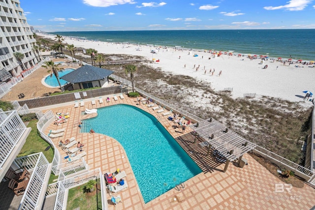 aerial view featuring a water view and a beach view