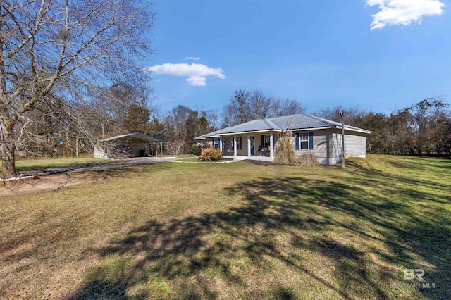 view of front of house with a carport, a porch, and a front yard