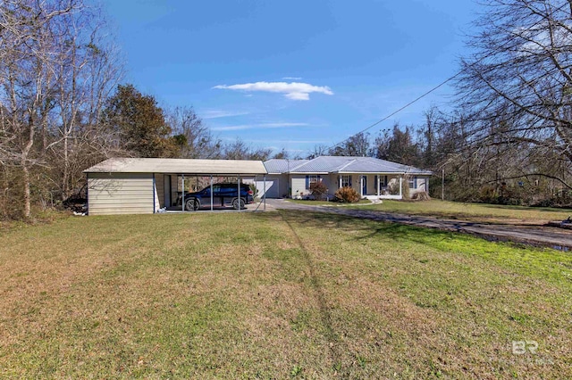 ranch-style house with a carport, driveway, and a front lawn