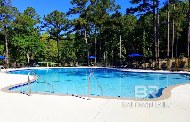 119 Sandlewood Cir, Daphne, AL 36526 - community pool featuring view of scattered trees and a patio