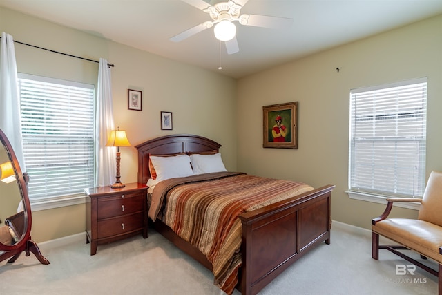 10752 Westwood Ave, Fairhope, AL 36532 - bedroom with light carpet, baseboards, and a ceiling fan