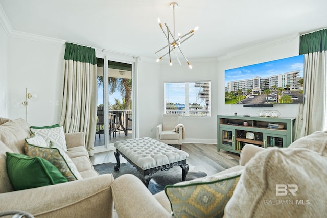 living room featuring a notable chandelier, light hardwood / wood-style flooring, and ornamental molding