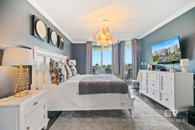 bedroom featuring ornamental molding and dark hardwood / wood-style floors