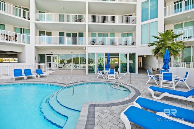 view of pool featuring a patio area