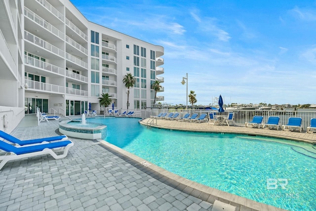 view of swimming pool featuring pool water feature