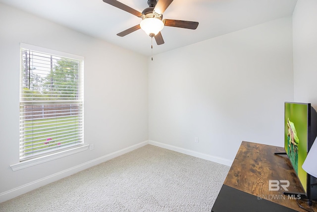 interior space with ceiling fan