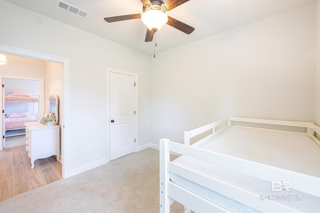 carpeted bedroom featuring ceiling fan