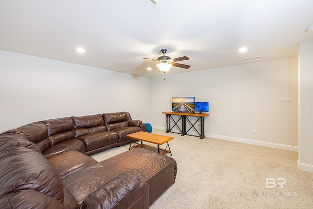 living room featuring carpet and ceiling fan