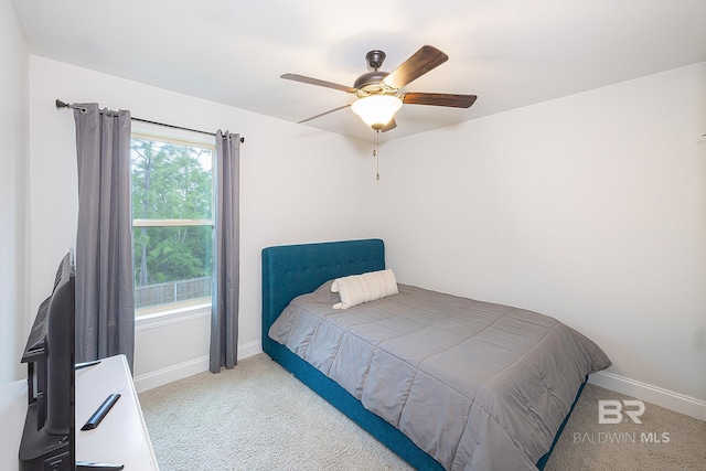 carpeted bedroom with ceiling fan