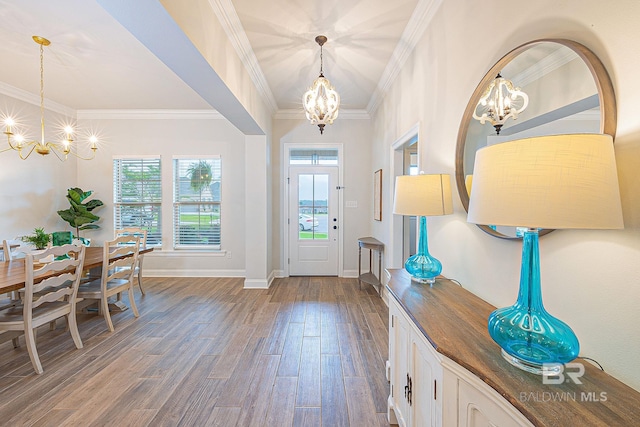 entrance foyer featuring crown molding, dark hardwood / wood-style floors, and a notable chandelier