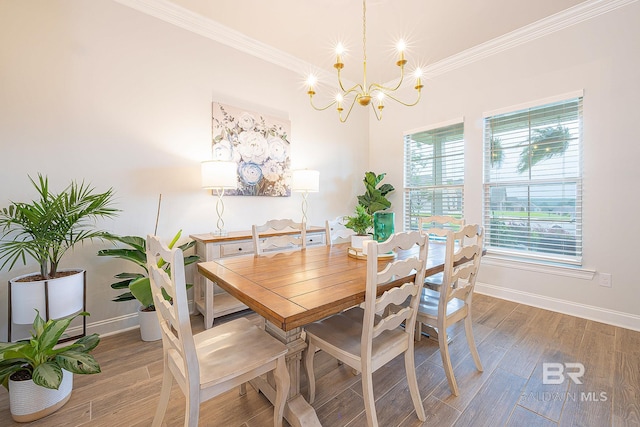 dining space featuring a notable chandelier, ornamental molding, and wood-type flooring