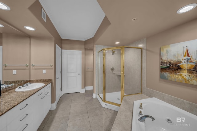 bathroom featuring visible vents, a whirlpool tub, a shower stall, tile patterned flooring, and vanity