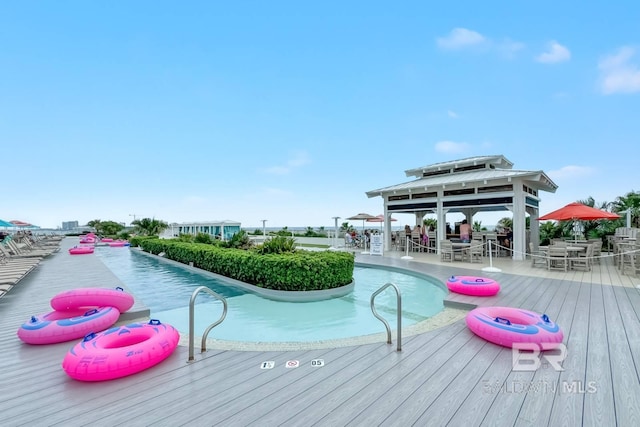 view of pool featuring outdoor dining space and a gazebo