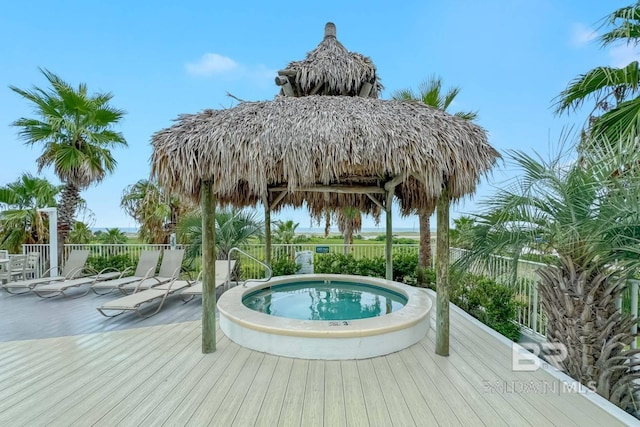 view of pool featuring a wooden deck and a community hot tub