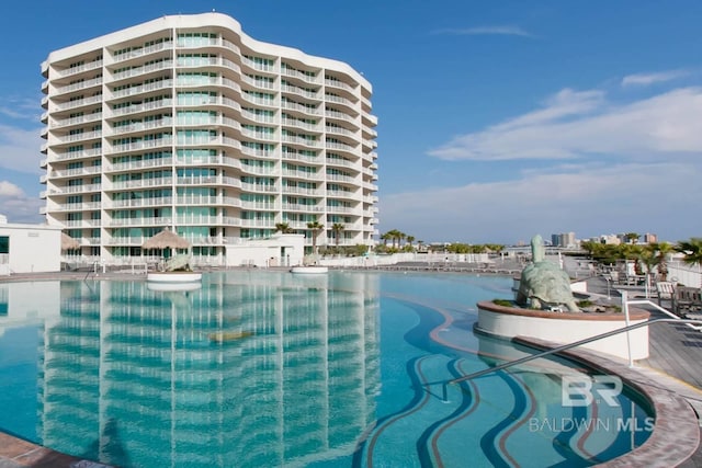 view of swimming pool featuring a view of city