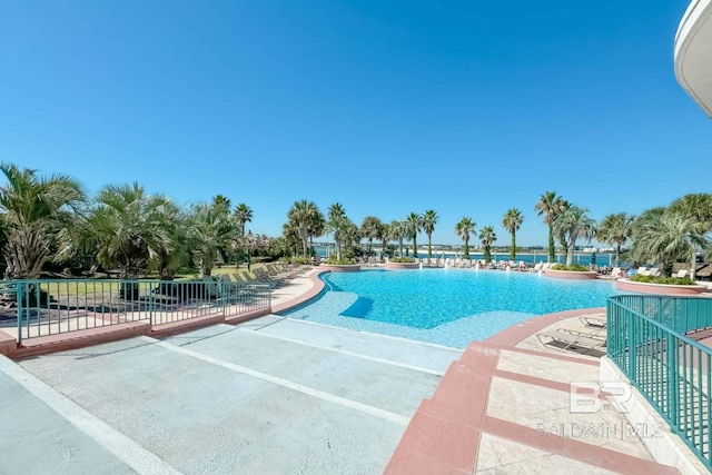 community pool with a patio area