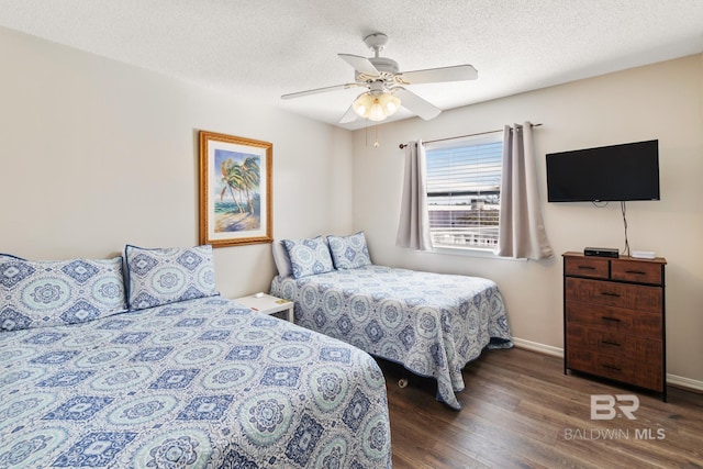 bedroom with ceiling fan, baseboards, a textured ceiling, and wood finished floors