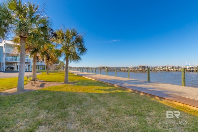 exterior space with a water view and a boat dock