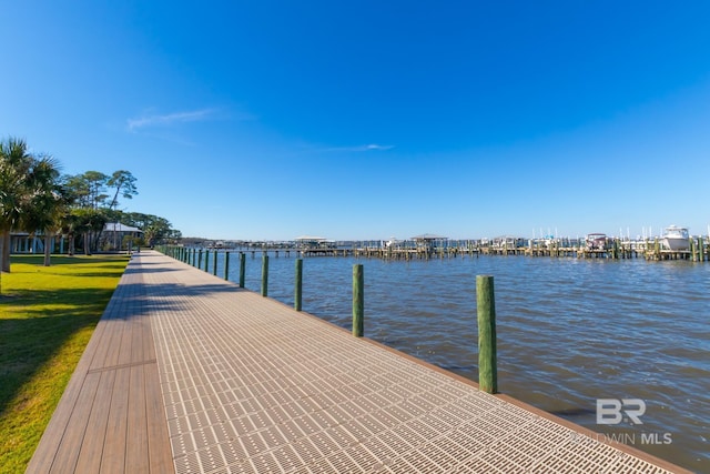 dock area featuring a yard and a water view