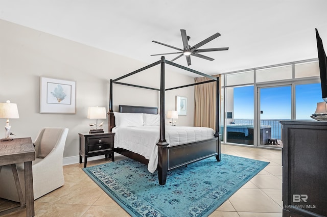 bedroom with a wall of windows, a ceiling fan, access to outside, and light tile patterned floors