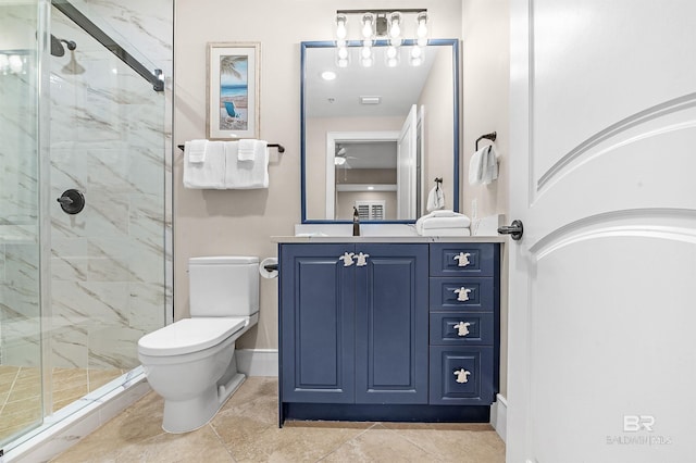 bathroom with baseboards, toilet, vanity, and a marble finish shower