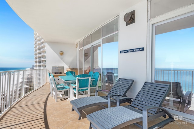 balcony featuring a water view