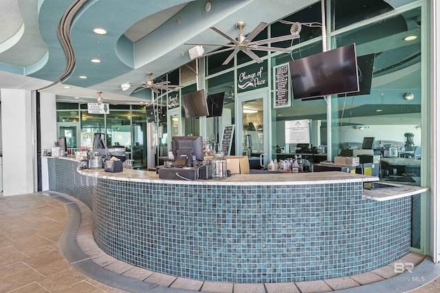 reception area with a ceiling fan