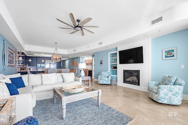 living area with a ceiling fan, visible vents, a fireplace, and light tile patterned floors