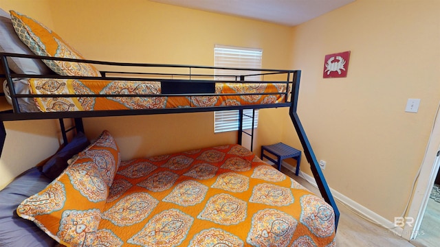 bedroom with wood-type flooring