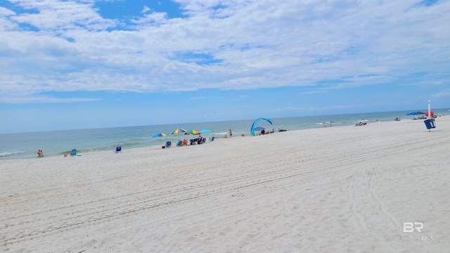 view of water feature with a beach view