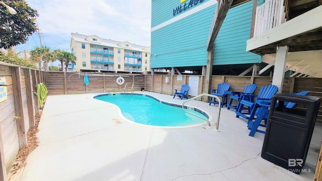 view of swimming pool with a patio area