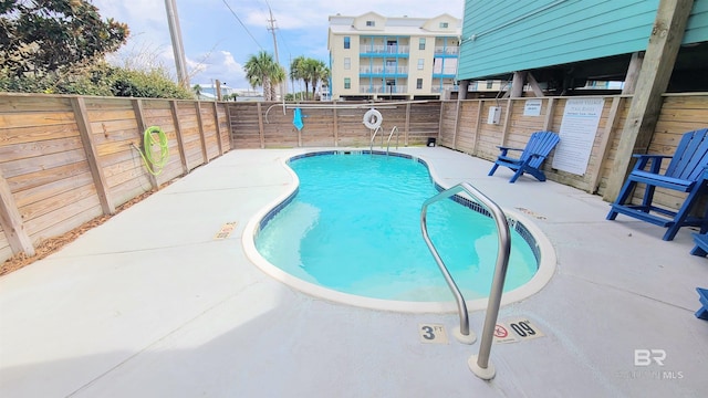 view of pool featuring a patio