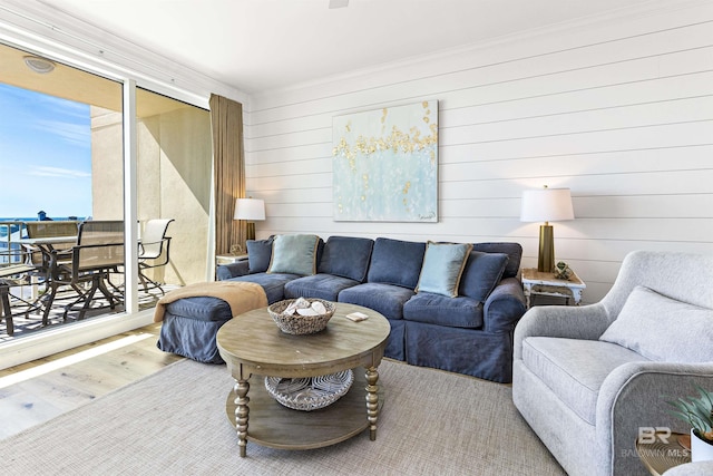 453 Dune Dr Unit 404, Gulf Shores, AL 36542 - living area with wood finished floors, ornamental molding, and wood walls