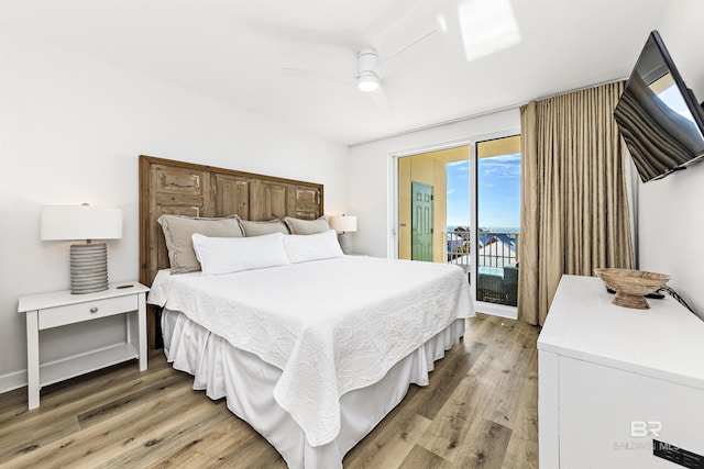 453 Dune Dr Unit 404, Gulf Shores, AL 36542 - bedroom featuring access to outside, light wood finished floors, and ceiling fan