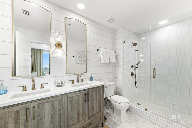 453 Dune Dr Unit 404, Gulf Shores, AL 36542 - bathroom featuring a shower stall, double vanity, recessed lighting, and marble look tiles