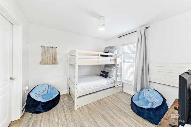 453 Dune Dr Unit 404, Gulf Shores, AL 36542 - bedroom featuring wood finished floors and baseboards