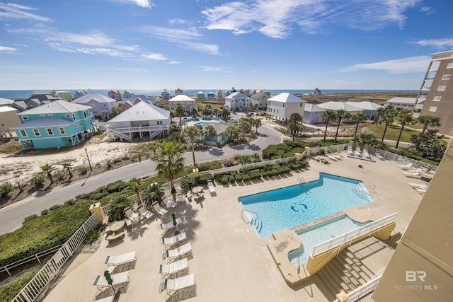 453 Dune Dr Unit 404, Gulf Shores, AL 36542 - community pool featuring a patio area and a residential view