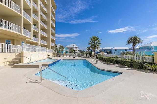 453 Dune Dr Unit 404, Gulf Shores, AL 36542 - community pool with a patio