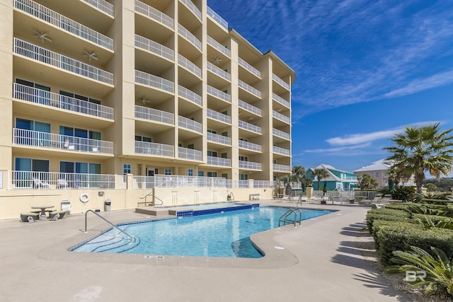 453 Dune Dr Unit 404, Gulf Shores, AL 36542 - community pool with a patio area