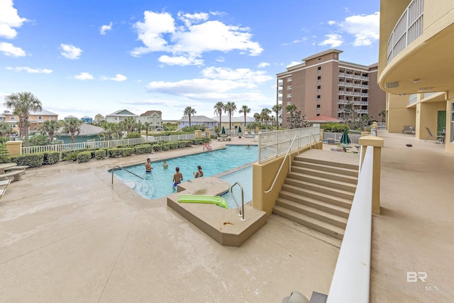453 Dune Dr Unit 404, Gulf Shores, AL 36542 - community pool featuring a patio