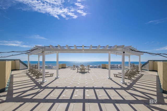 453 Dune Dr Unit 404, Gulf Shores, AL 36542 - view of patio with a pergola and a water view