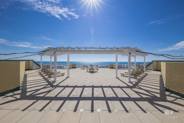 453 Dune Dr Unit 404, Gulf Shores, AL 36542 - view of patio with a pergola and a water view