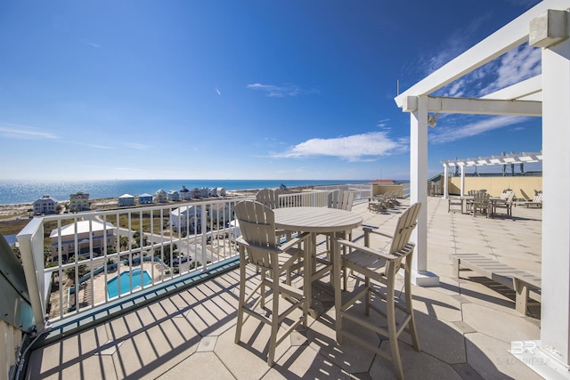 453 Dune Dr Unit 404, Gulf Shores, AL 36542 - view of patio featuring a pergola, a water view, an outdoor pool, and outdoor dining space